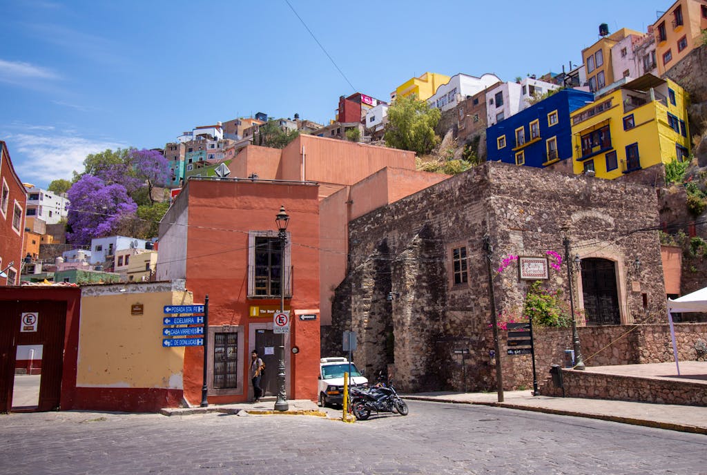 Vibrant street view of colorful houses in Guanajuato, Mexico.